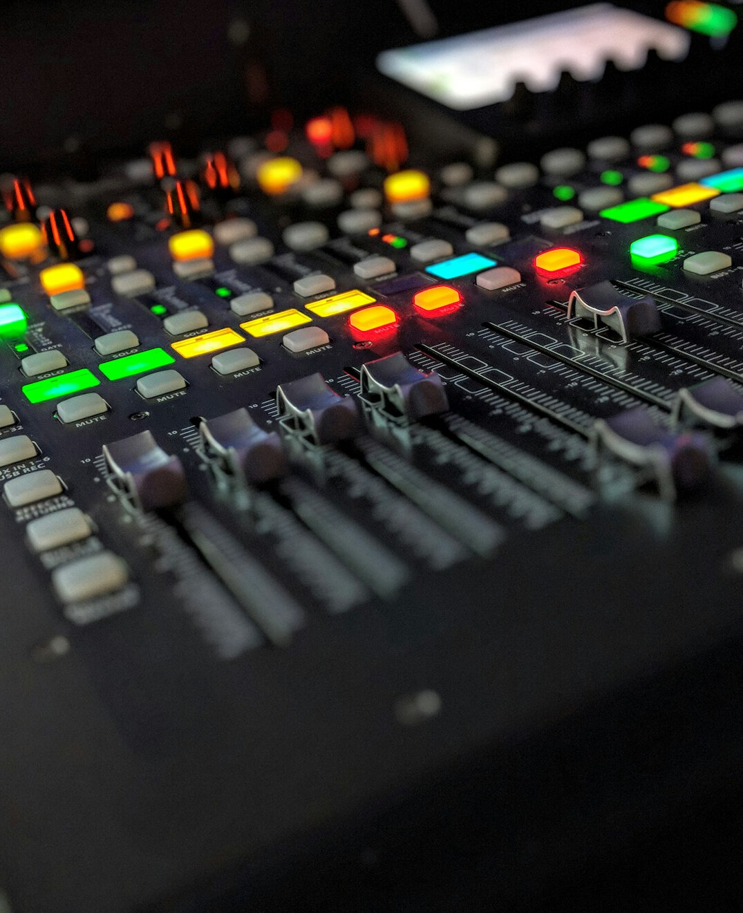 sound engineer adjusting mixer