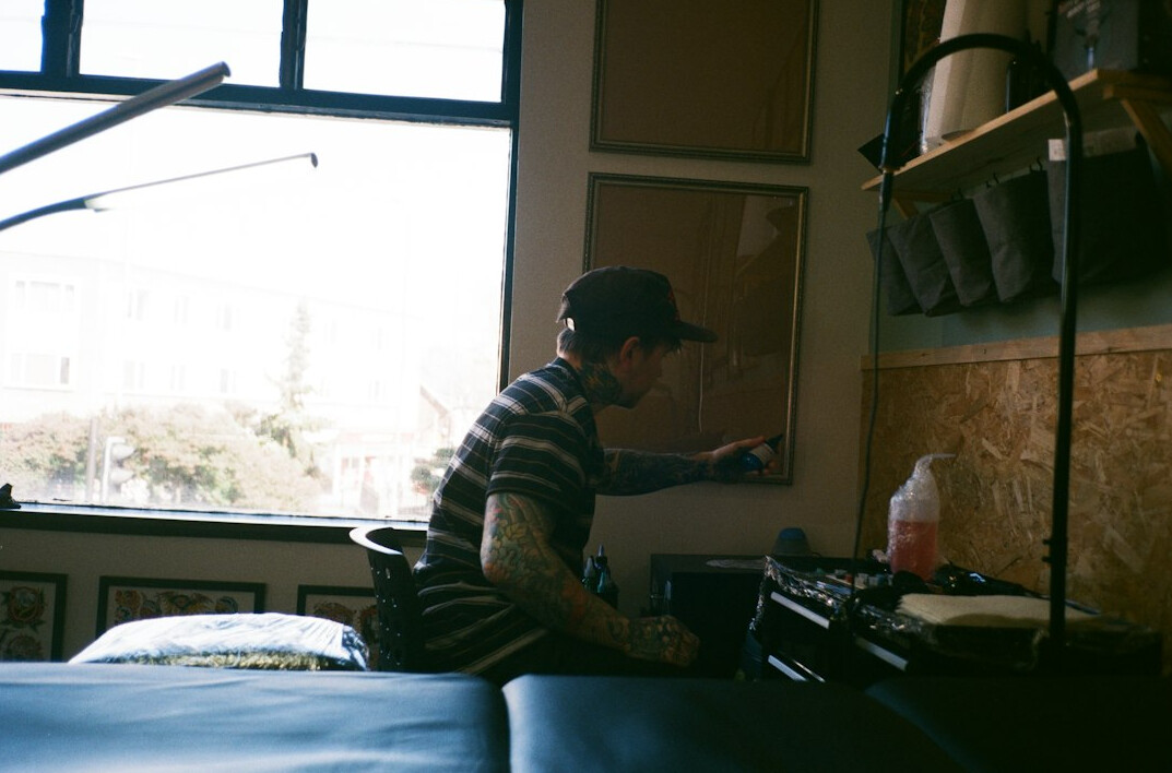 Podcast host recording an episode in a modern studio with microphone and headphones